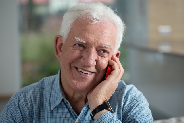 Senior man using mobile phone