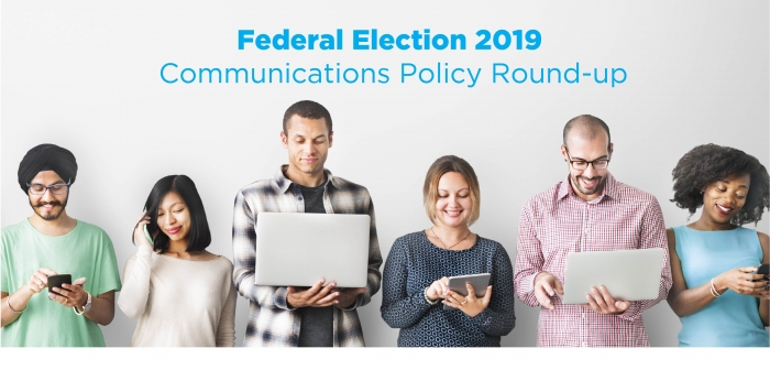 Image of people standing in a line using laptops and phones. Text reads: Federal Election 2019: Communications Policy Round-Up