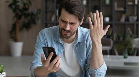 Man frustrated his phone is not working