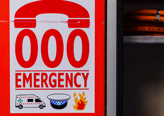 000 emergency sign showing Ambulance, Police, Fire