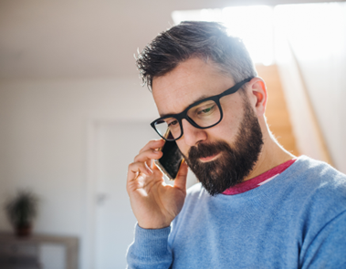 Bearded man on phone