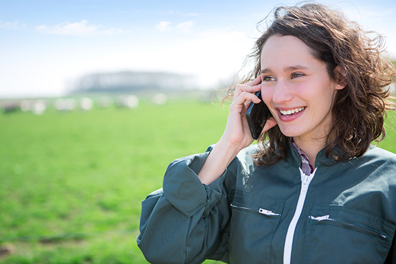 Farmer using phone in remote location