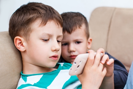 Kids using smartphone