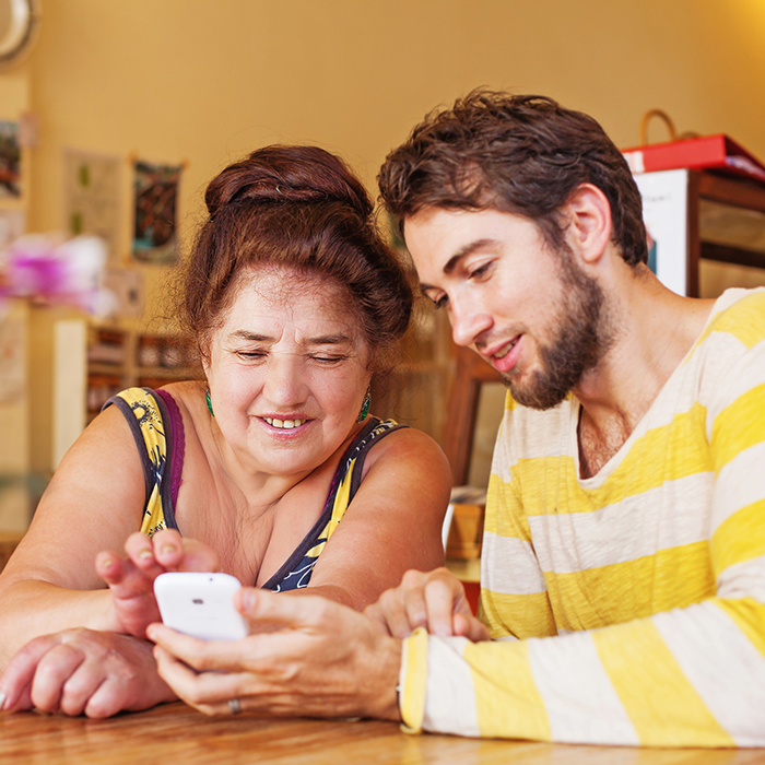 Grandson helping grandmother find ways to stay connected