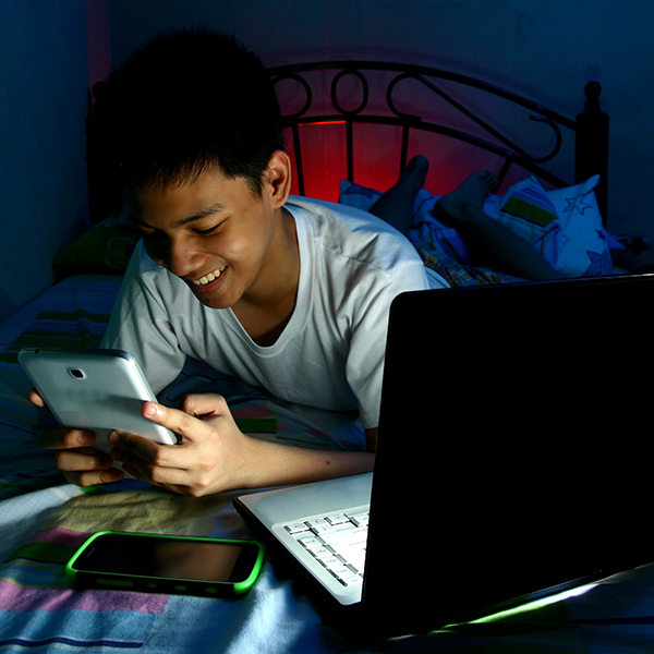 Boy using mobile devices