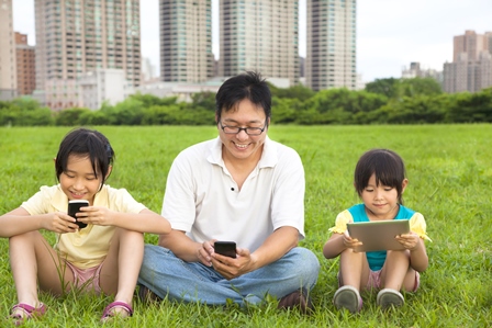 Family using mobile devices