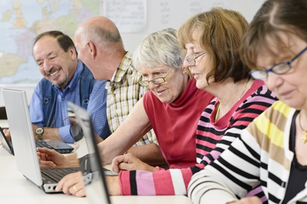 Seniors using laptops