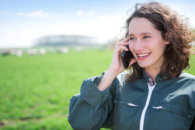 Female farmer using smartphone