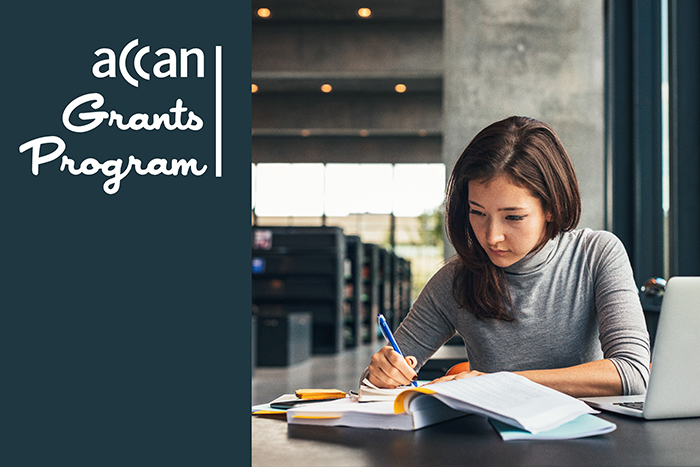 Grants Program Banner: Woman researching at a University